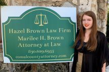 photo of attorney Jessica Trussell with firm sign